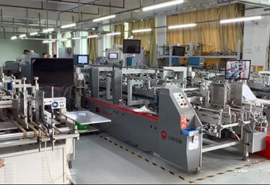 Automated folder-gluer machine processing folding cartons