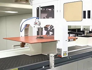 Paperboard die-cutting machinery in operation