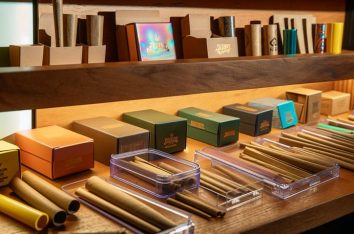 Various-pre-roll-packaging-options-displayed-on-a-shelf-mypaperboxes.com_